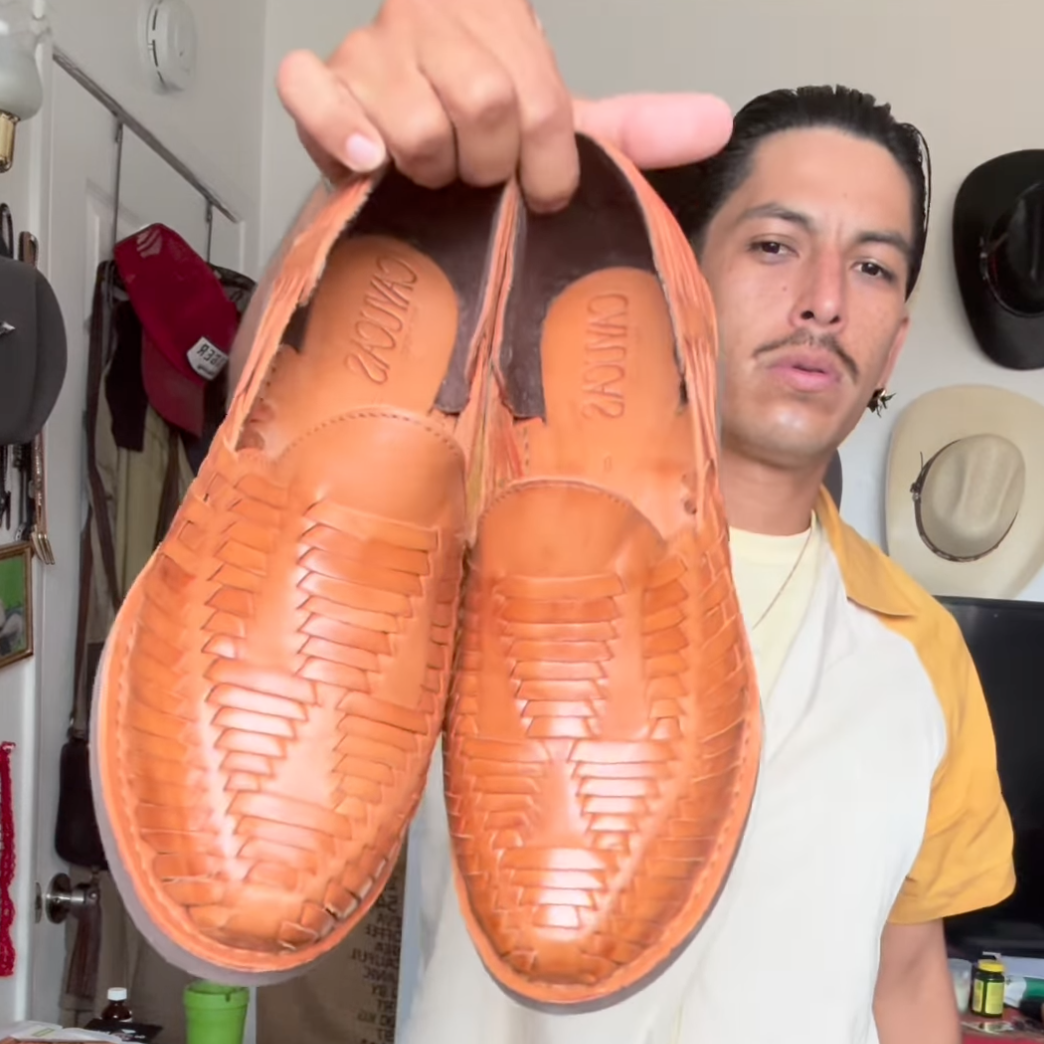 Cayucas Noa, tan woven leather huarache loafer held up, handmade in Mexico